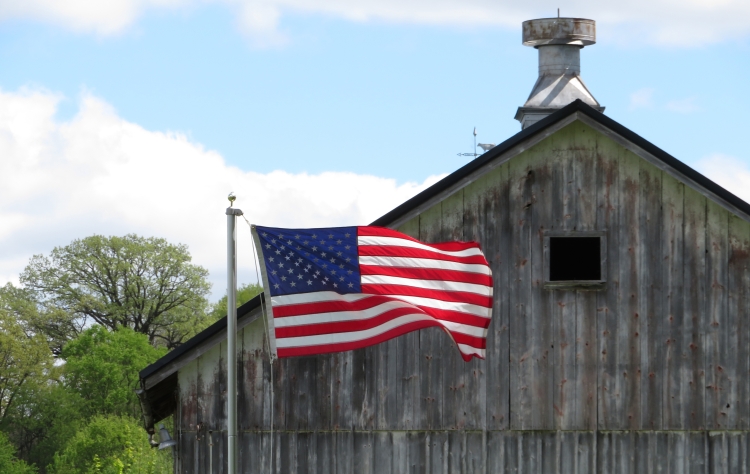 American Flag with Rustic Barn Background